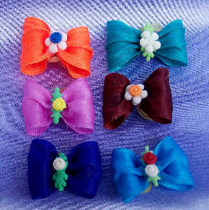 Colorful small pet bows for dogs or cats.